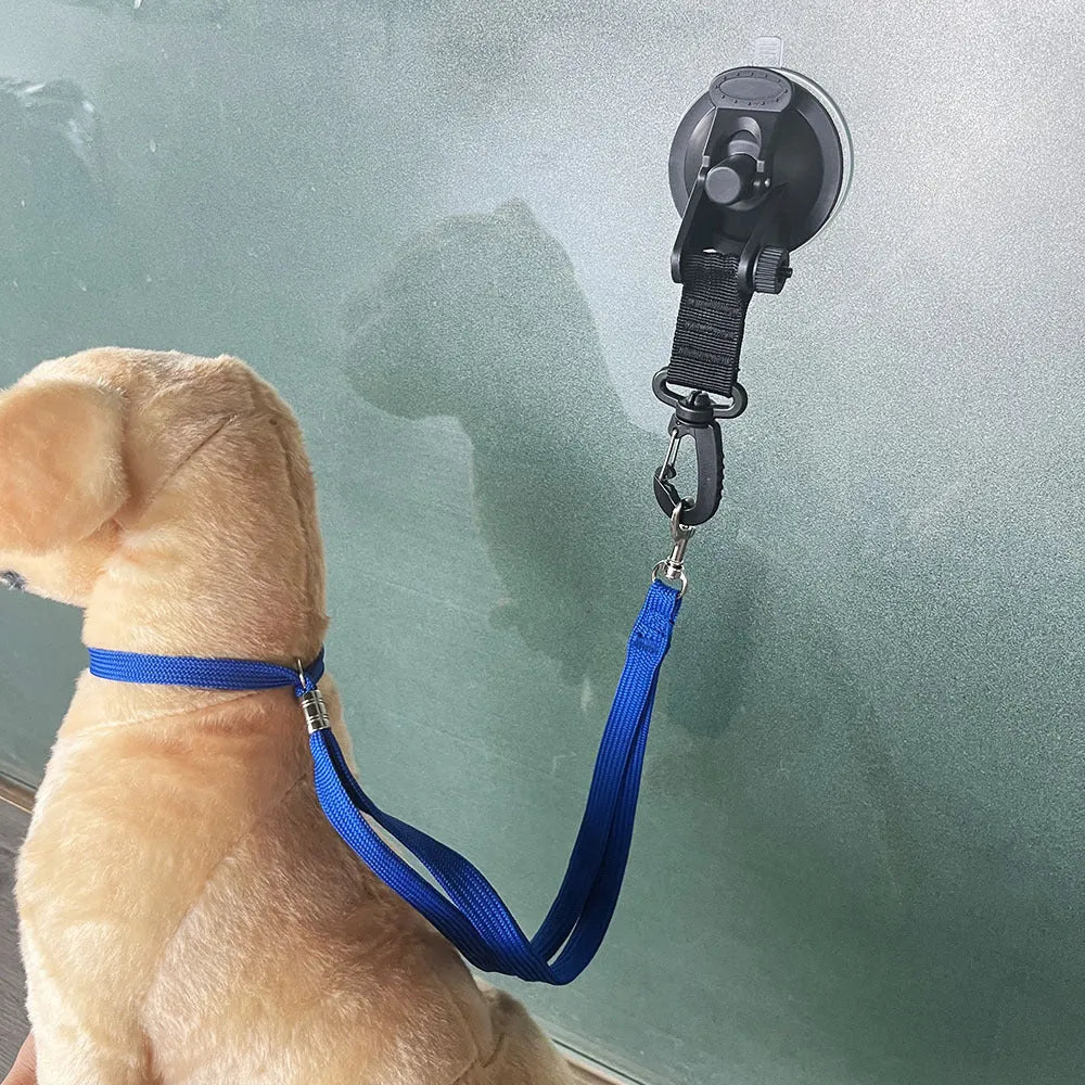 Pet bathing restraint kit showing four adjustable handcuffs with suction cup bases in black and blue colours