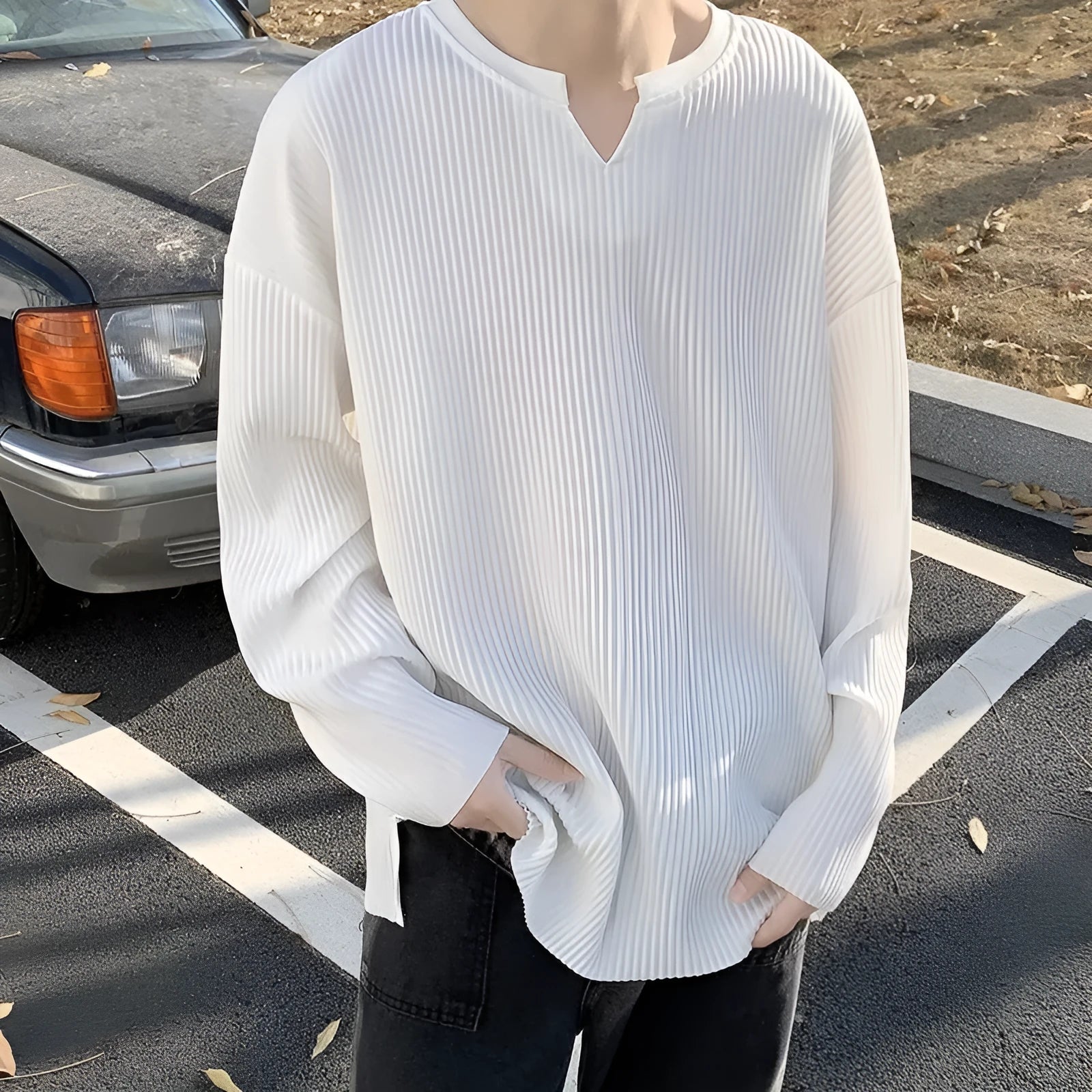 Plus size women's striped texture draping solid colour pullover top in black, loose fit, long sleeves, polyester knit