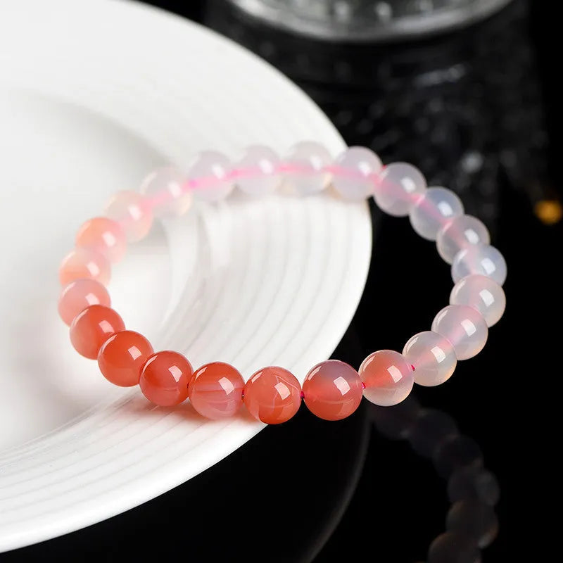 Natural gradient Yanyuan agate bracelet with geometric beads in four size options.
