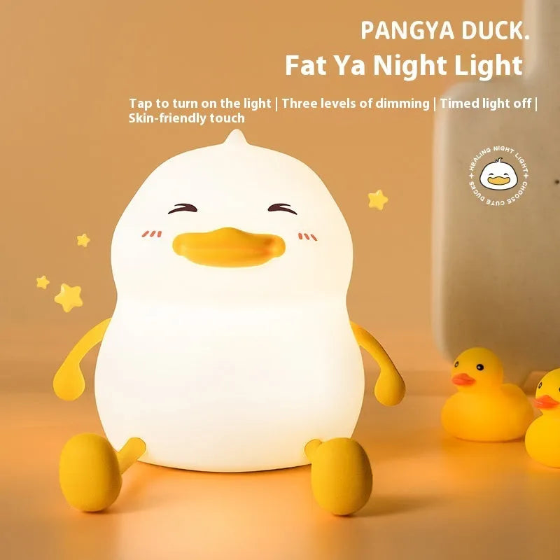 Chubby night light desk lamp with silicone phone holder surface showing three brightness settings