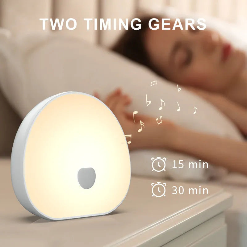 White rechargeable baby night feeding comforter with music function on a plain background.
