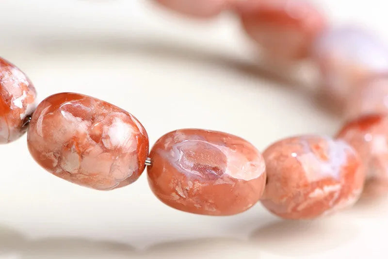 Natural cherry blossom agate bracelet with 10x14mm barrel beads and Ruyi geometric design elements