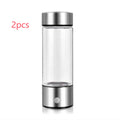 Hydrogen water bottle in silver with electric base, borosilicate glass body, 21.5cm tall, 401-500ml capacity