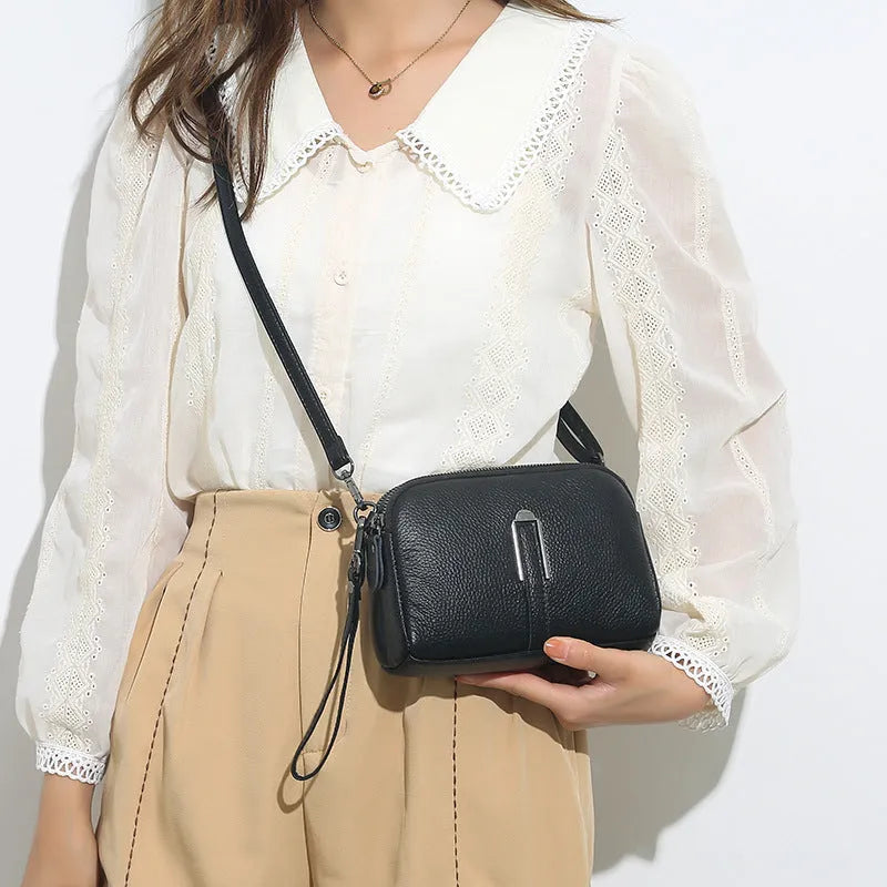 Genuine leather ladies shoulder bag in urban simplicity style, horizontal square shape, compact 19x13x6cm size.
