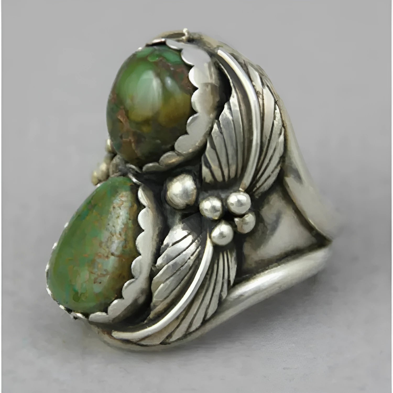 Turquoise geometric women's ring with electroplated alloy construction showing inlaid design details