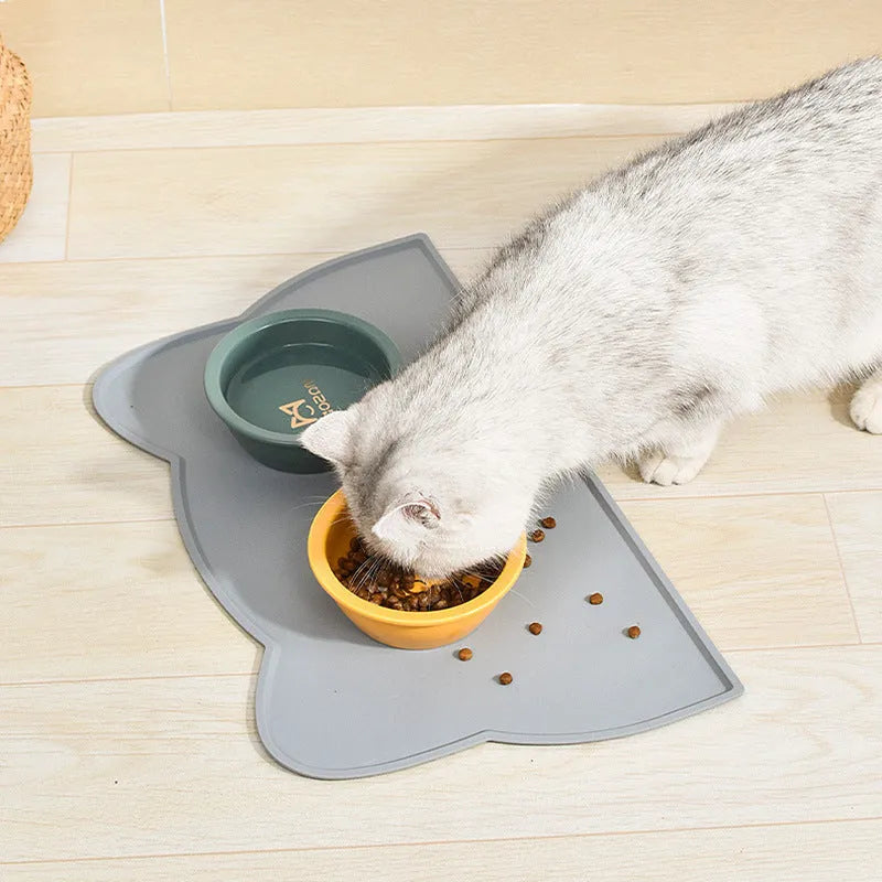 Blue silicone waterproof pet feeding mat with cat head shape, 44 by 24 centimetres