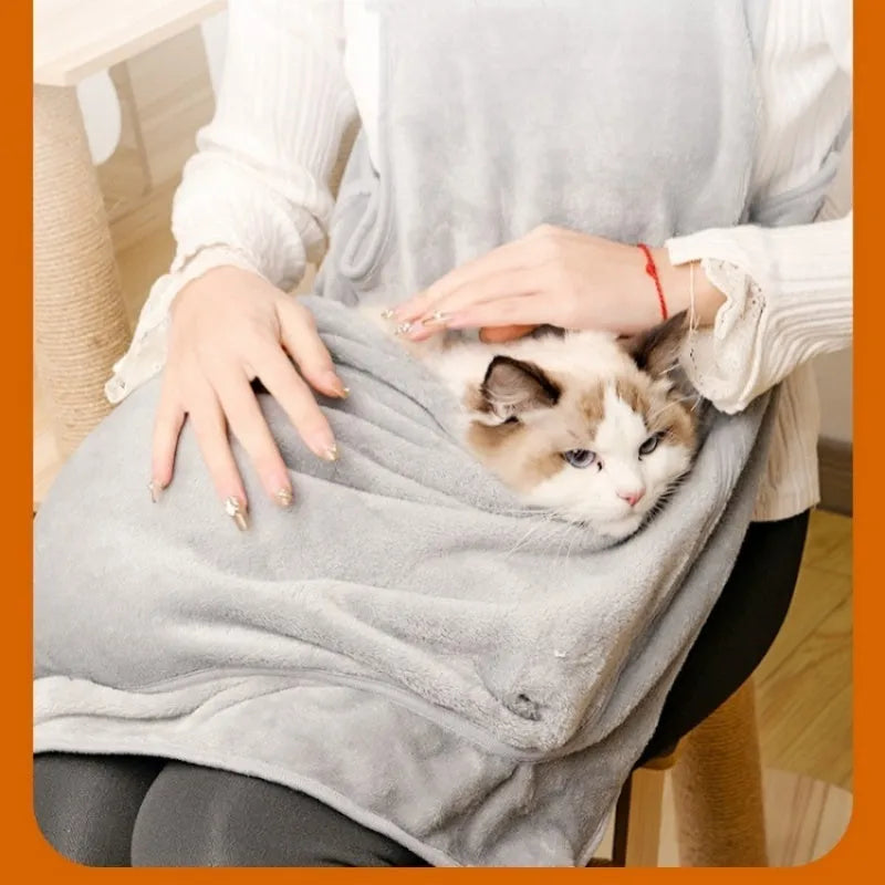 Plush pet carrier apron in beige with adjustable neck strap and head opening for small cats or dogs