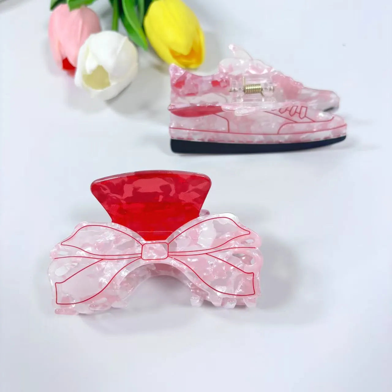 Acrylic bow tie hair grip in cream with glitter oil injection finish, 8cm long, for women