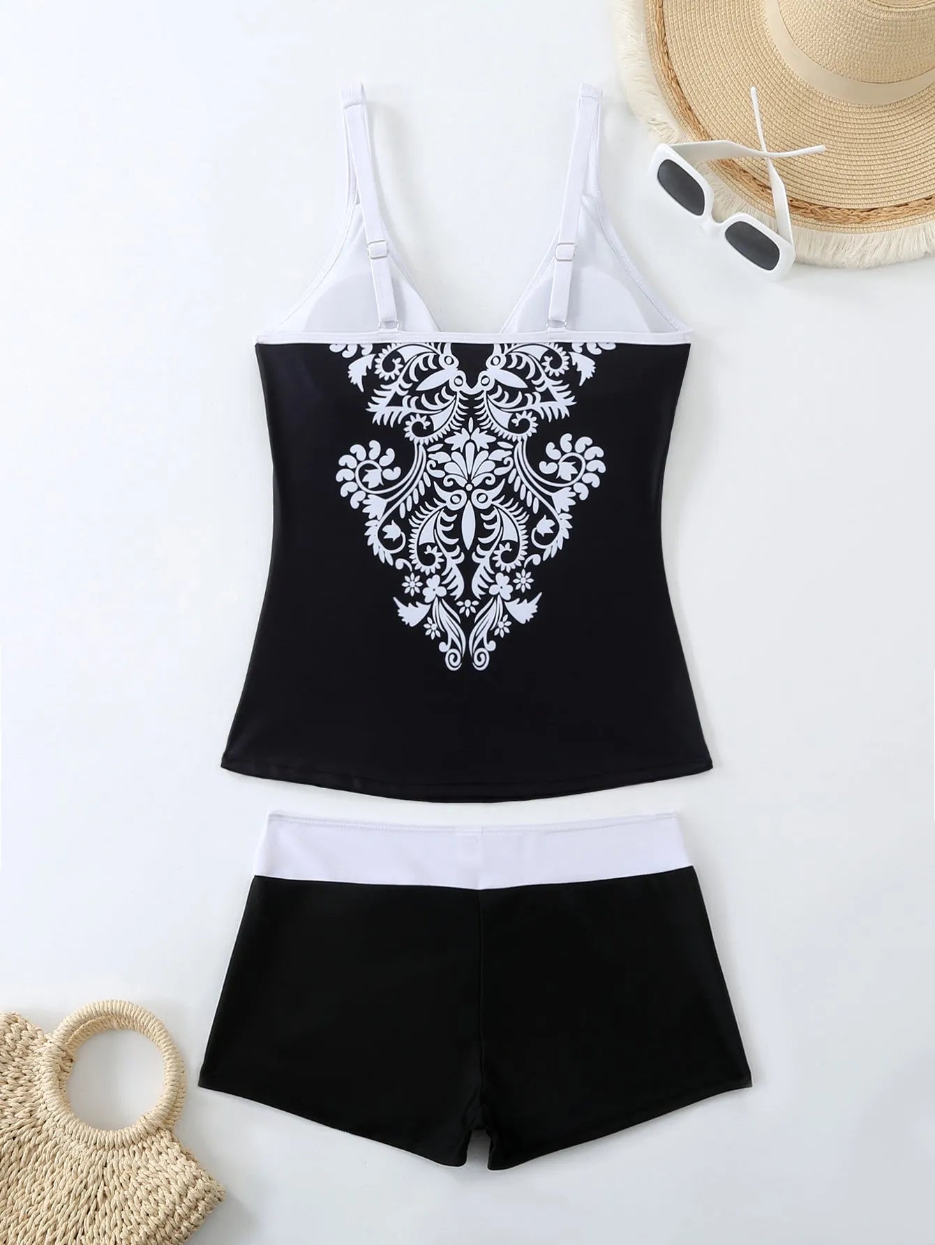 Plus size black and rose red two-piece swimsuit set with briefs and swimming trunks.