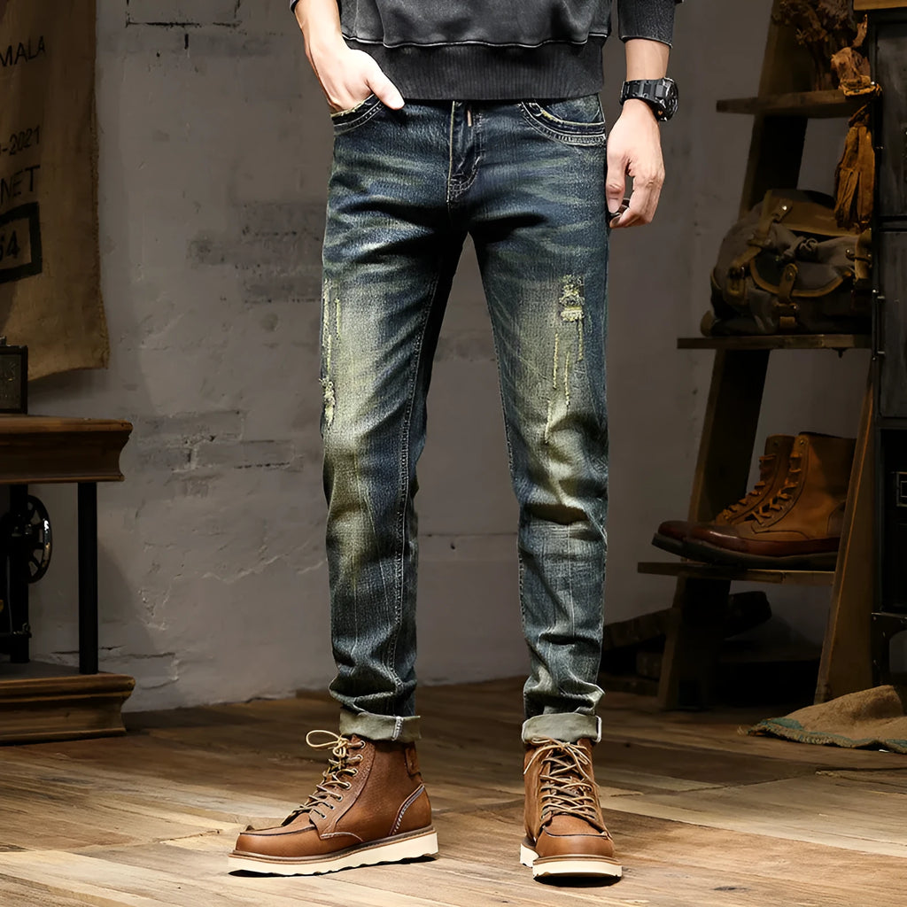 Men's skinny fit jeans in a retro blue denim wash with a zip fly closure.
