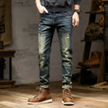 Men's skinny fit jeans in a retro blue denim wash with a zip fly closure.