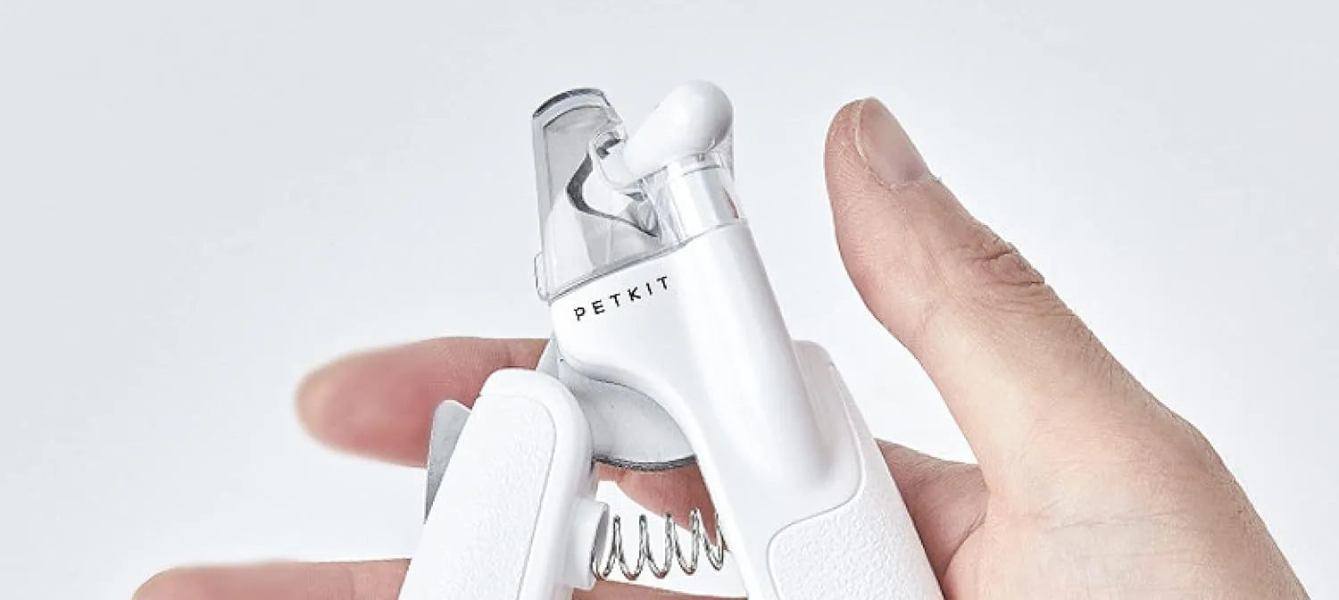 White pet nail clippers with LED light, triangular blade, and transparent anti-splash guard