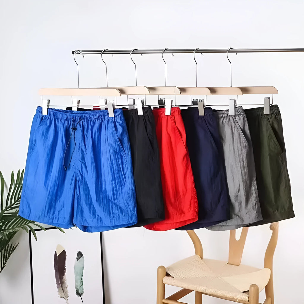 Men's quick-drying polyester sports shorts in 236 blue, straight-leg cut, side view