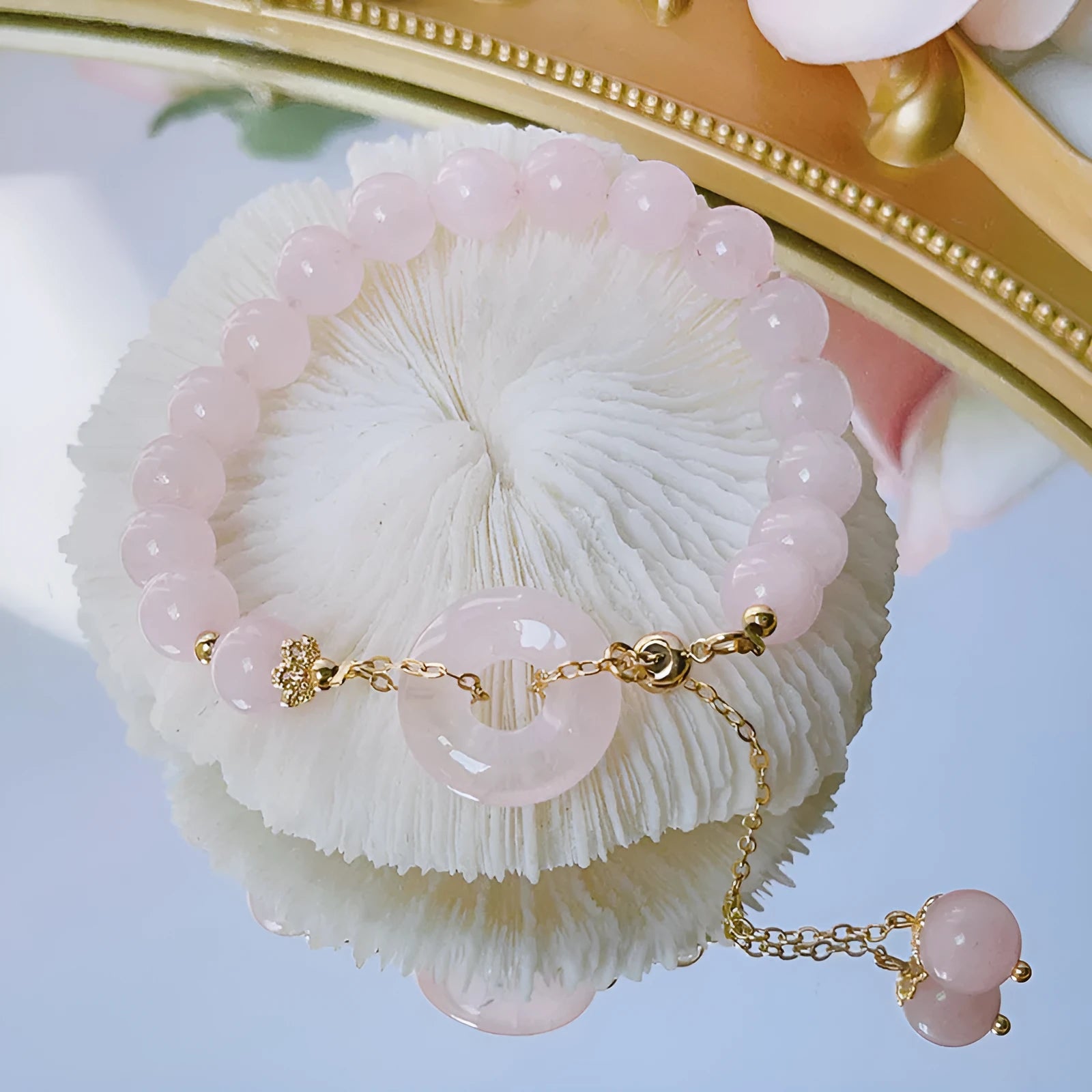 Crystal safety buckle bracelet for women in pink with peace buckle design on white background