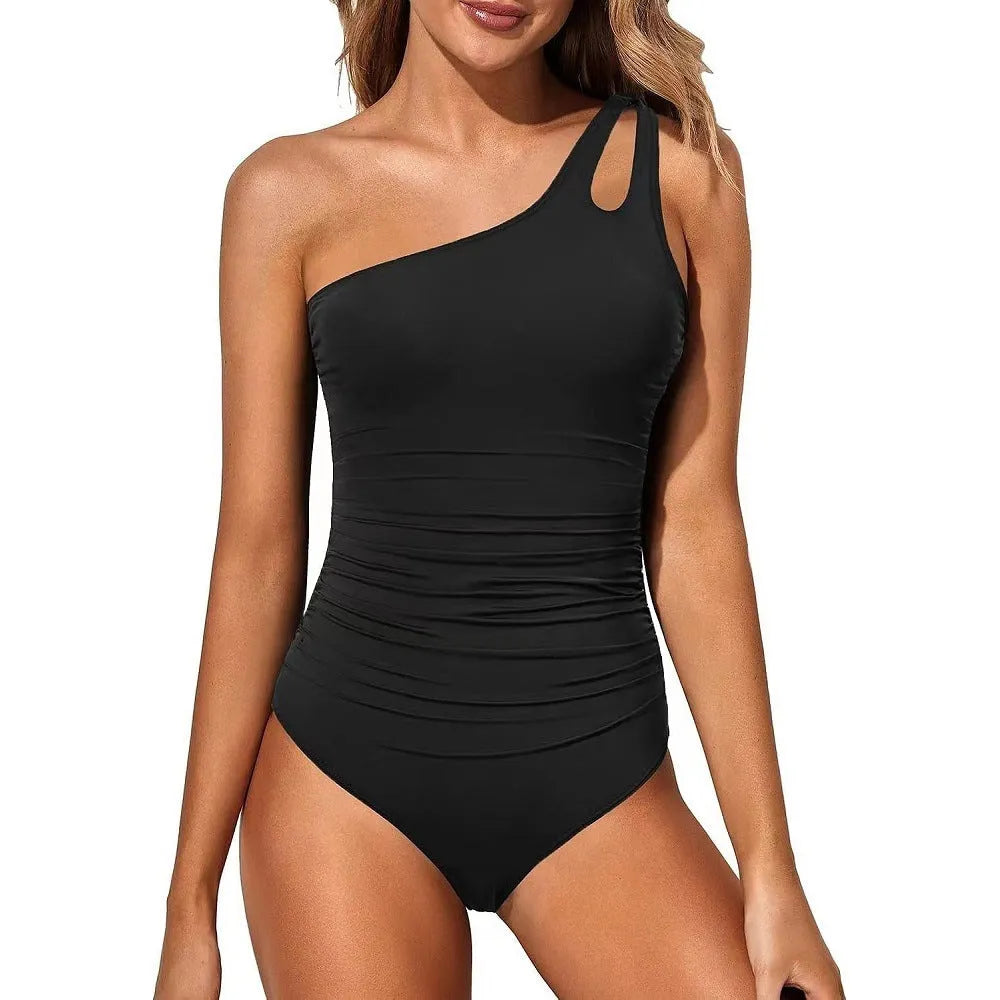 Women's solid colour one-piece nylon swimsuit in black, front view on model