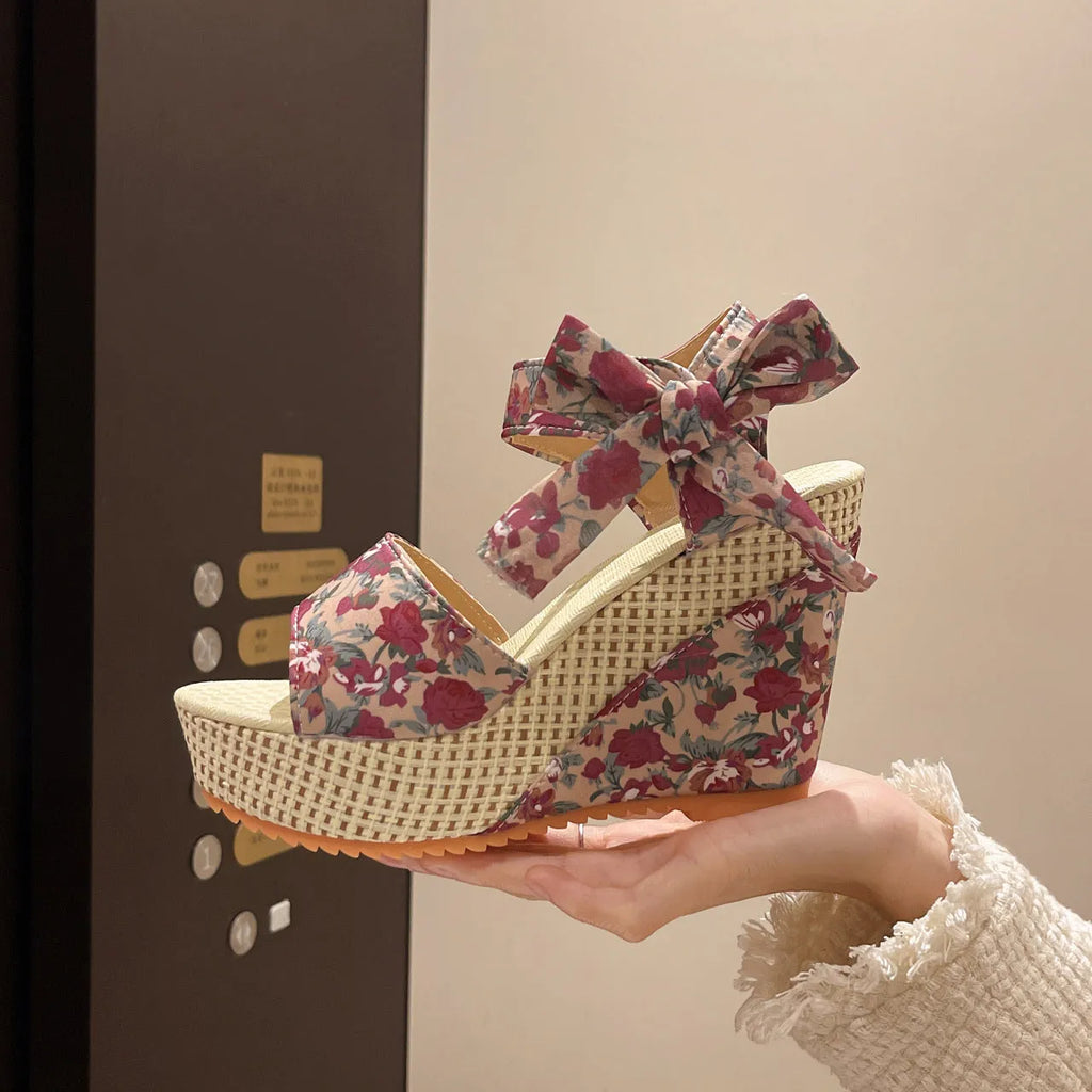 Women's peep toe sandals with cloth upper, ankle-strap buckle, and rubber sole in pink floral colour