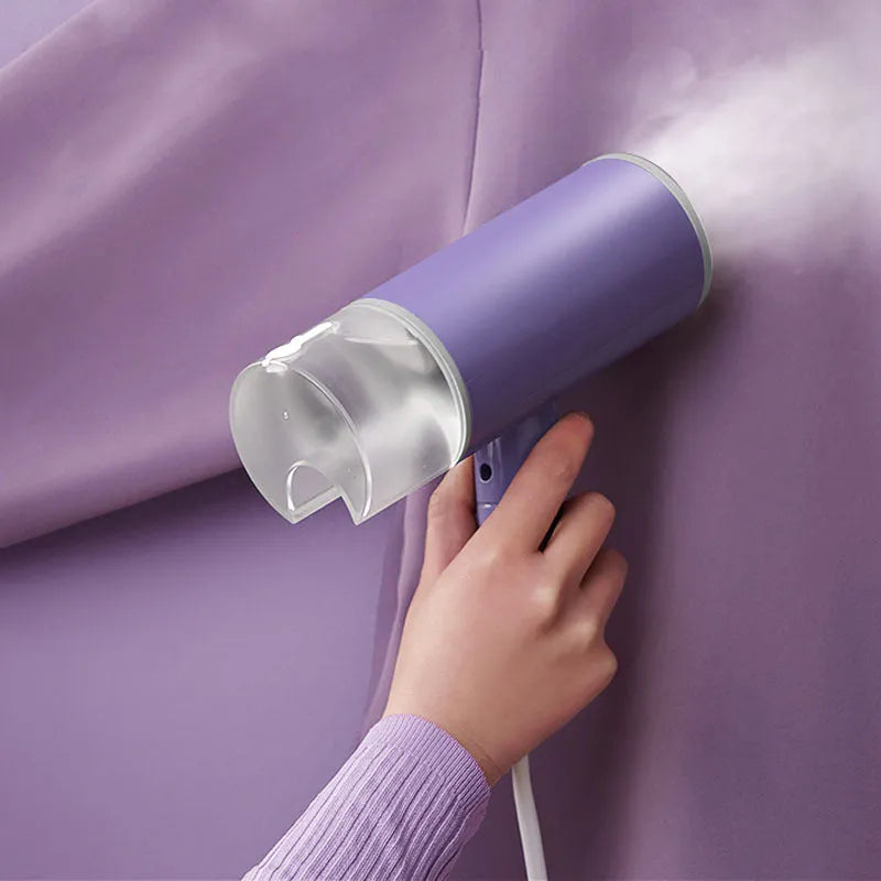 Portable foldable steam iron 130ml 220V in Grey Lotus Root Purple on white background