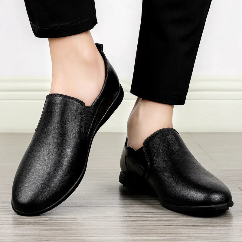 Men's black cowhide leather round toe business casual shoes on a white background
