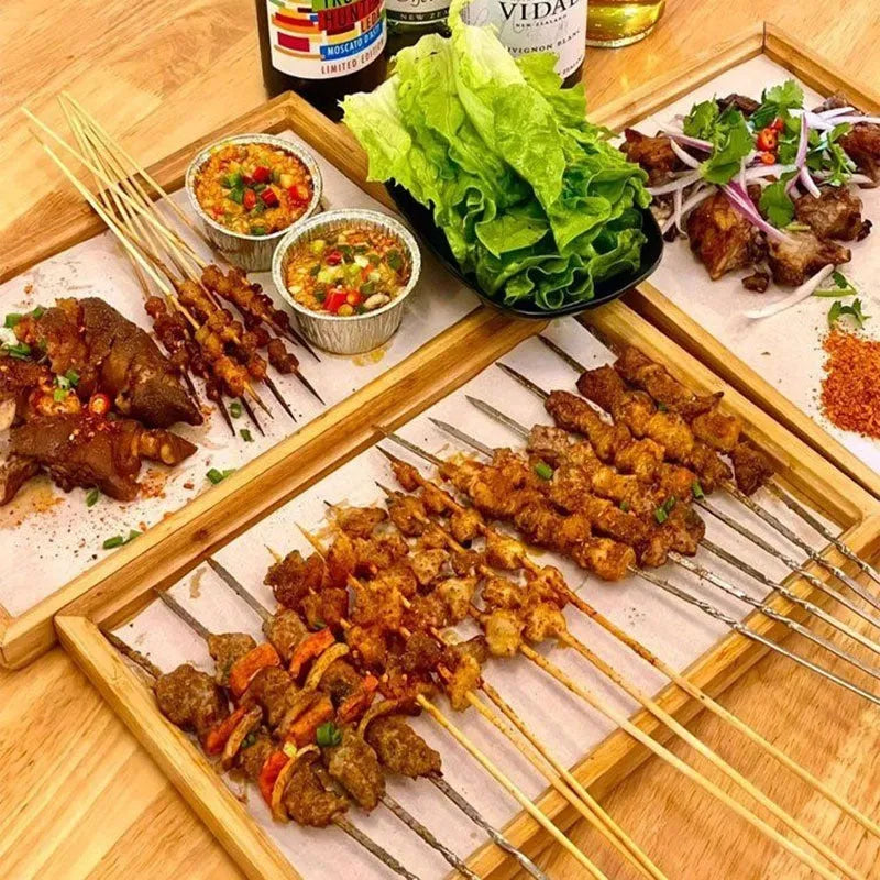 Brown-handle bamboo square serving tray on a table
