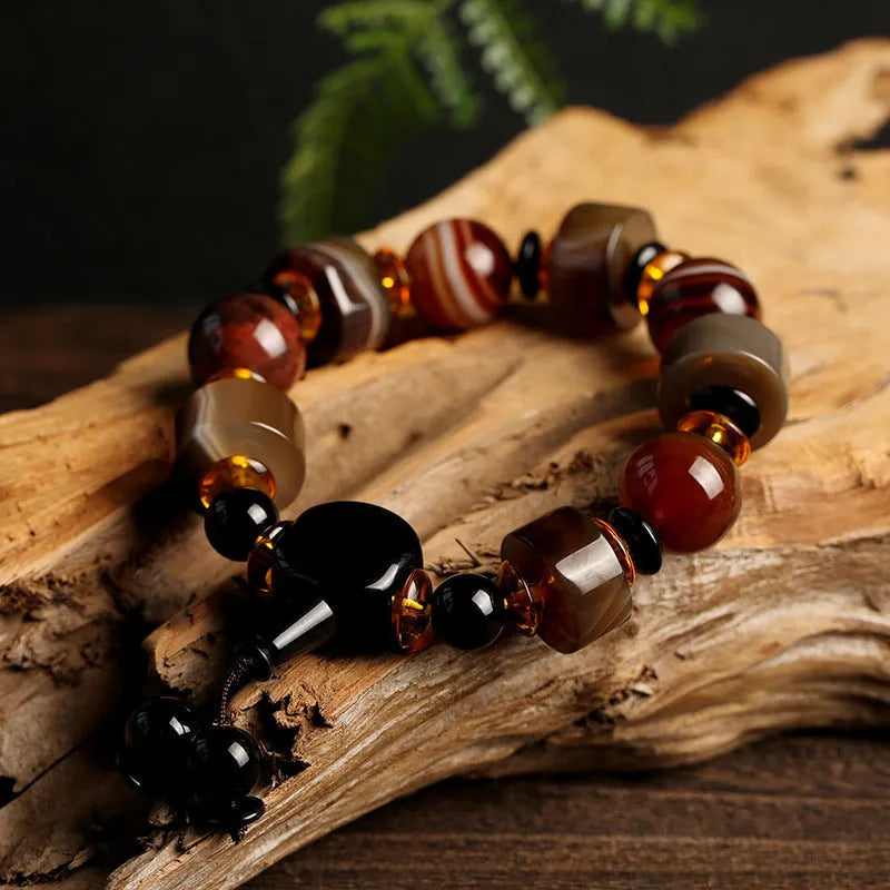 Natural twining line old agate bracelet with sardonyx agate abacus beads and white and red agate spacer beads on neutral background
