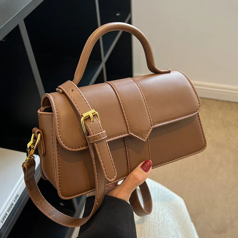 Women's beige PU messenger bag showing internal file organisation and sandwich pocket exterior