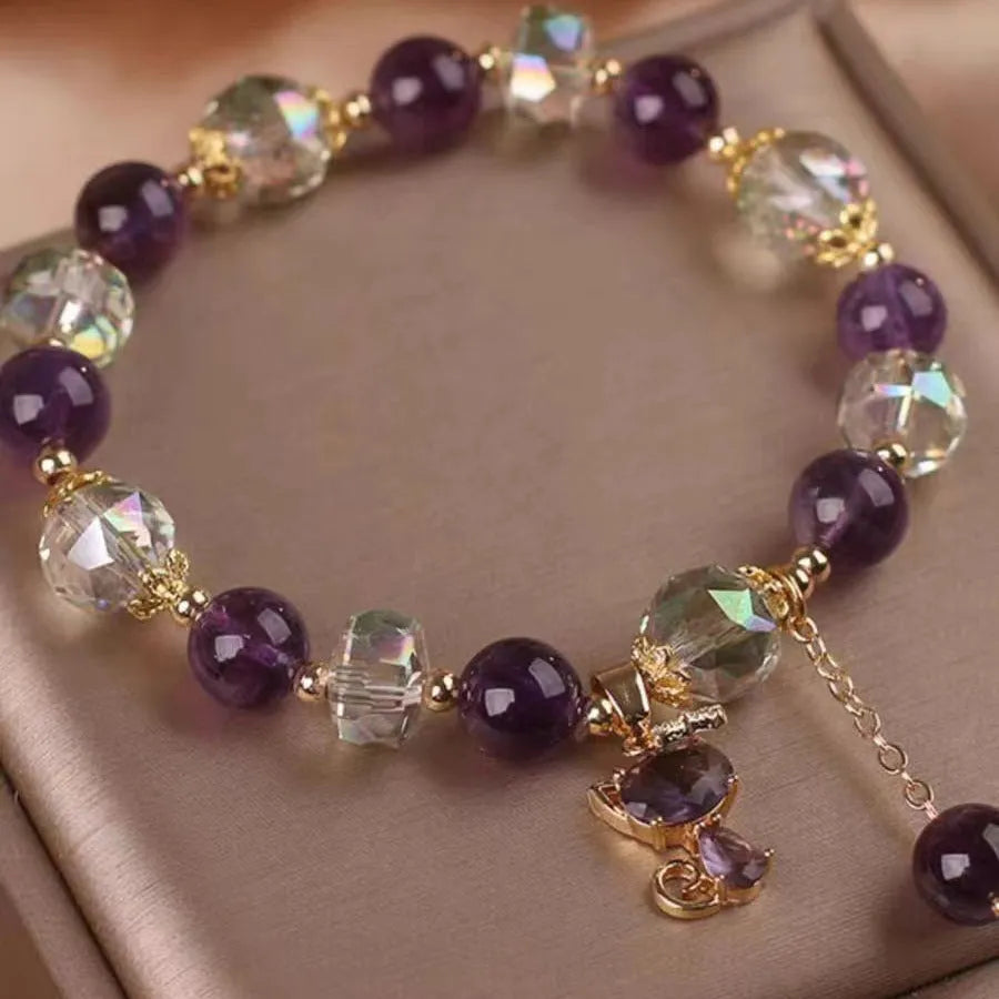Natural amethyst fox pendant bracelet with five-leaf flower and nine-tailed fox charm, antique style, on a neutral background