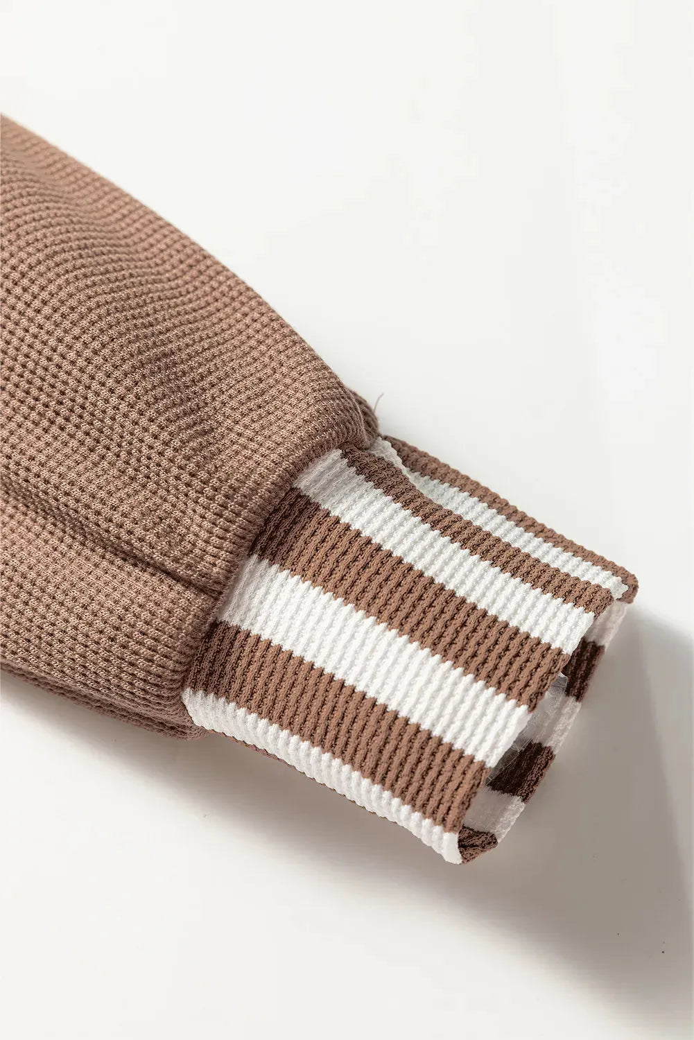 Straw yellow waffle texture hoodie with striped patchwork panels and button neck closure