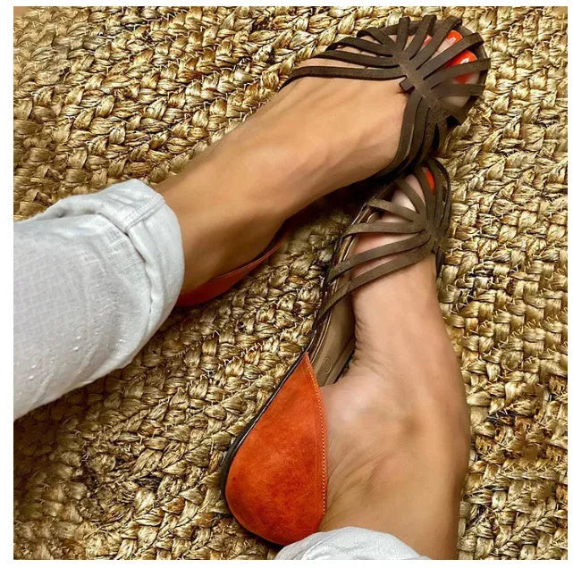 Women's leopard print flat-heel sandals with a square buckle and ankle strap.