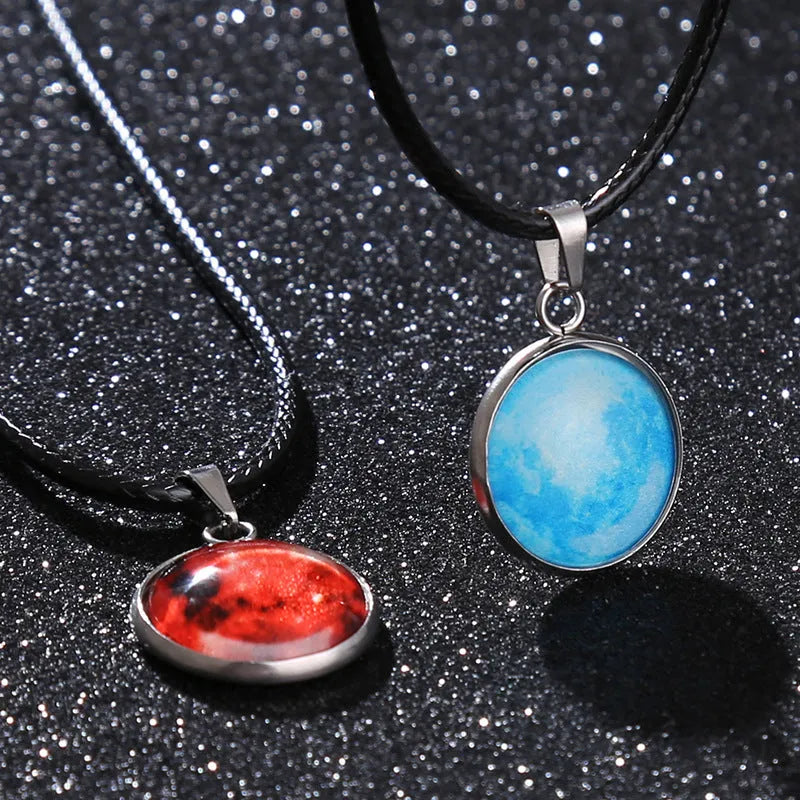 Luminous alloy pendant necklace with Christmas moon, night sky, and constellation design on a glass centrepiece.