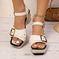 Women's white chunky heel sandals with a square toe and metal buckle closure on a rubber sole.