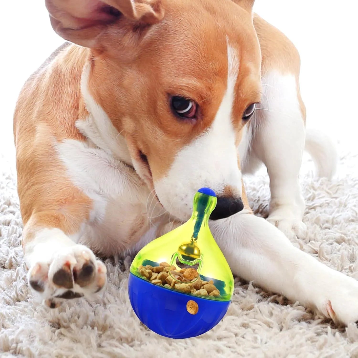 Blue tumbler-shaped interactive treat dispenser ball for dogs and cats on a wooden floor