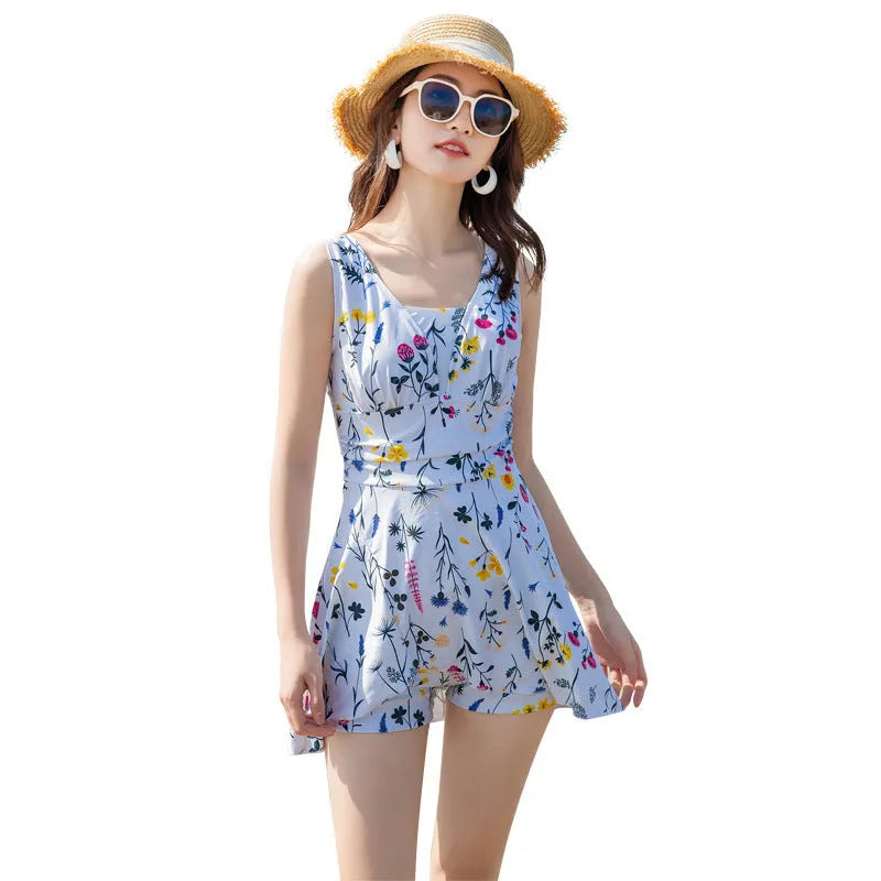Women's floral print one-piece swimsuit in white polyester fibre, available in sizes M to 2XL