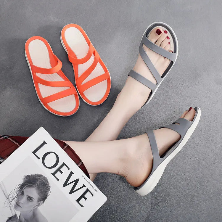 Women's solid colour casual sandals on a beach background, showing red, blue, and black colour options.