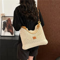 Large capacity knitted tote beach bag in brown with contrast stitching, bucket shape, crossbody strap, and zipped internal compartment