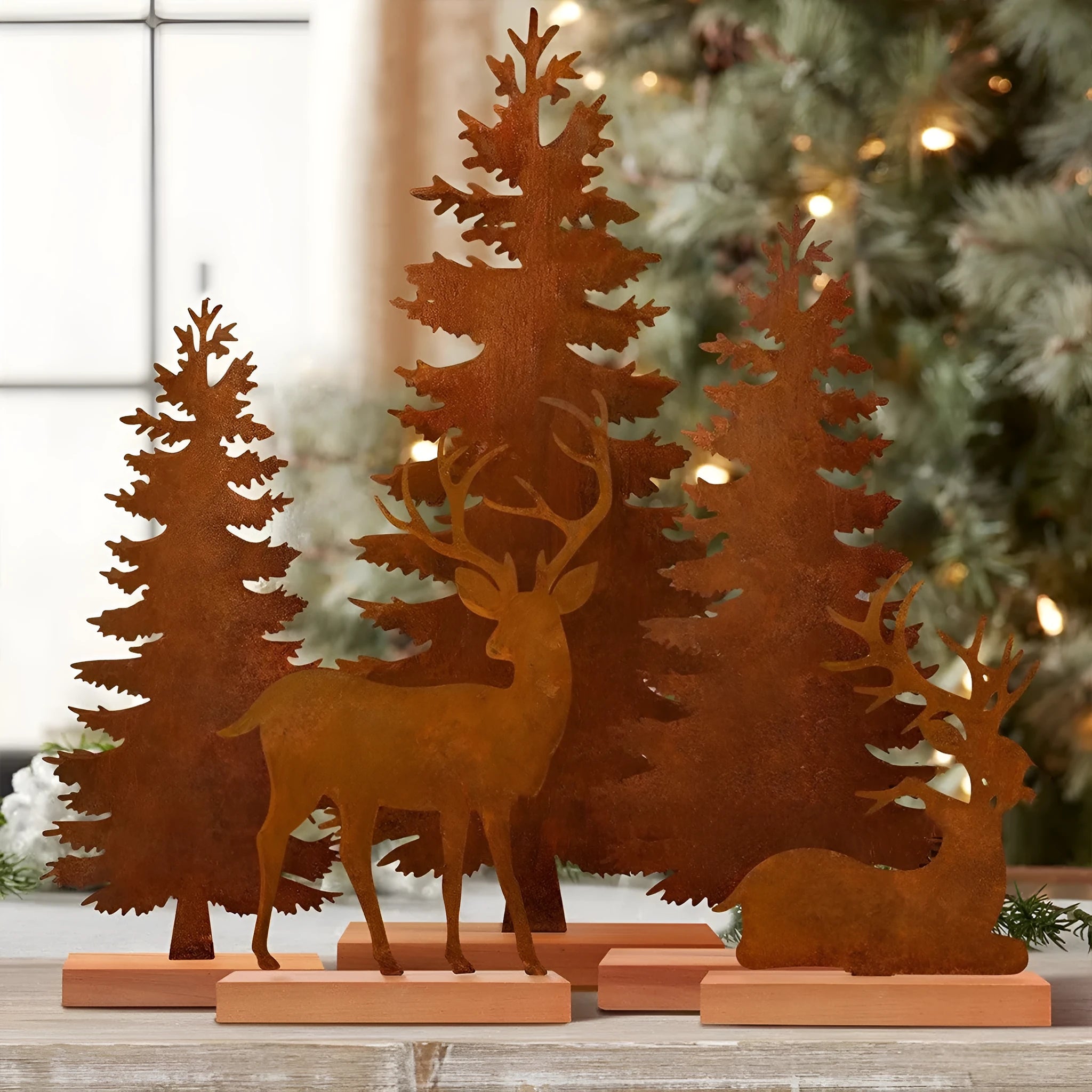 Three metal Christmas tree decorations with elk antlers in rustic finish
