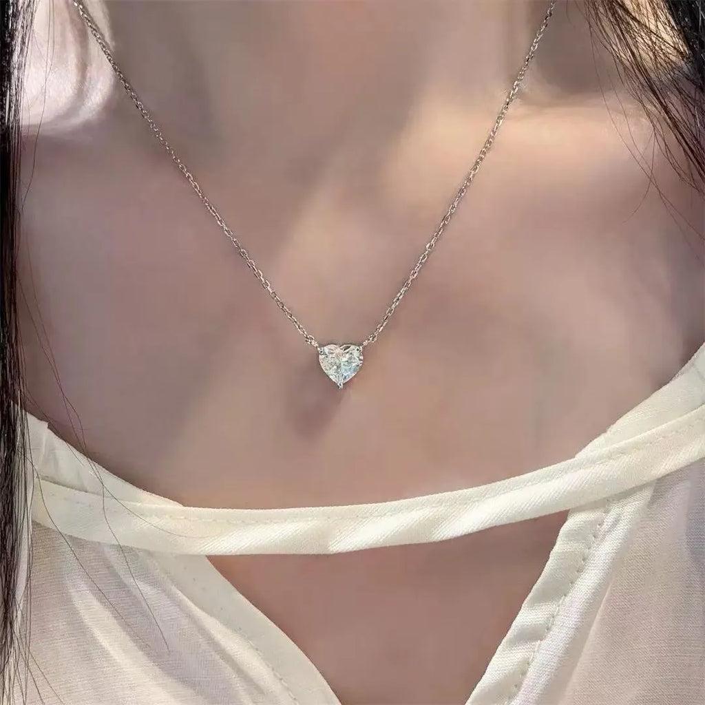 Women's minimalist heart necklace in silver tone with copper construction