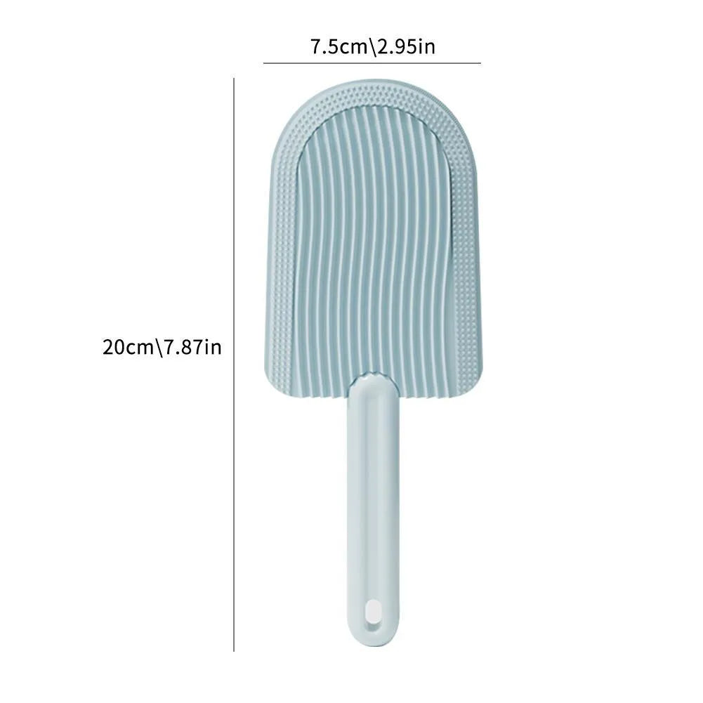 Soft silicone pet hair brush in green, foldable design for portable grooming