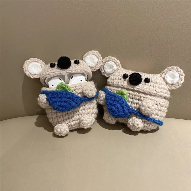 Hand-knitted koala bear backpack design cover for Apple AirPods charging case on a white background.