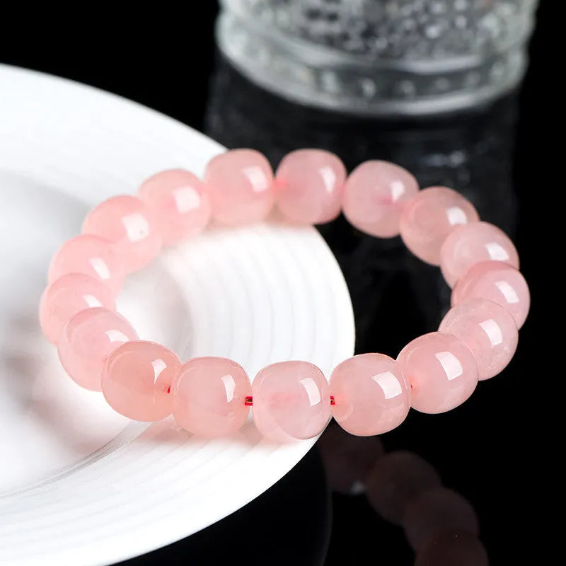 Pink natural crystal barrel bead bracelet with polished 8 x 10mm beads