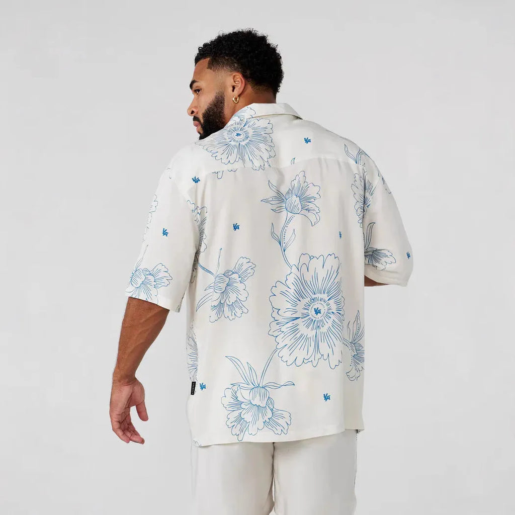 Men's loose-fitting printed short sleeve top with floral pattern in light colours