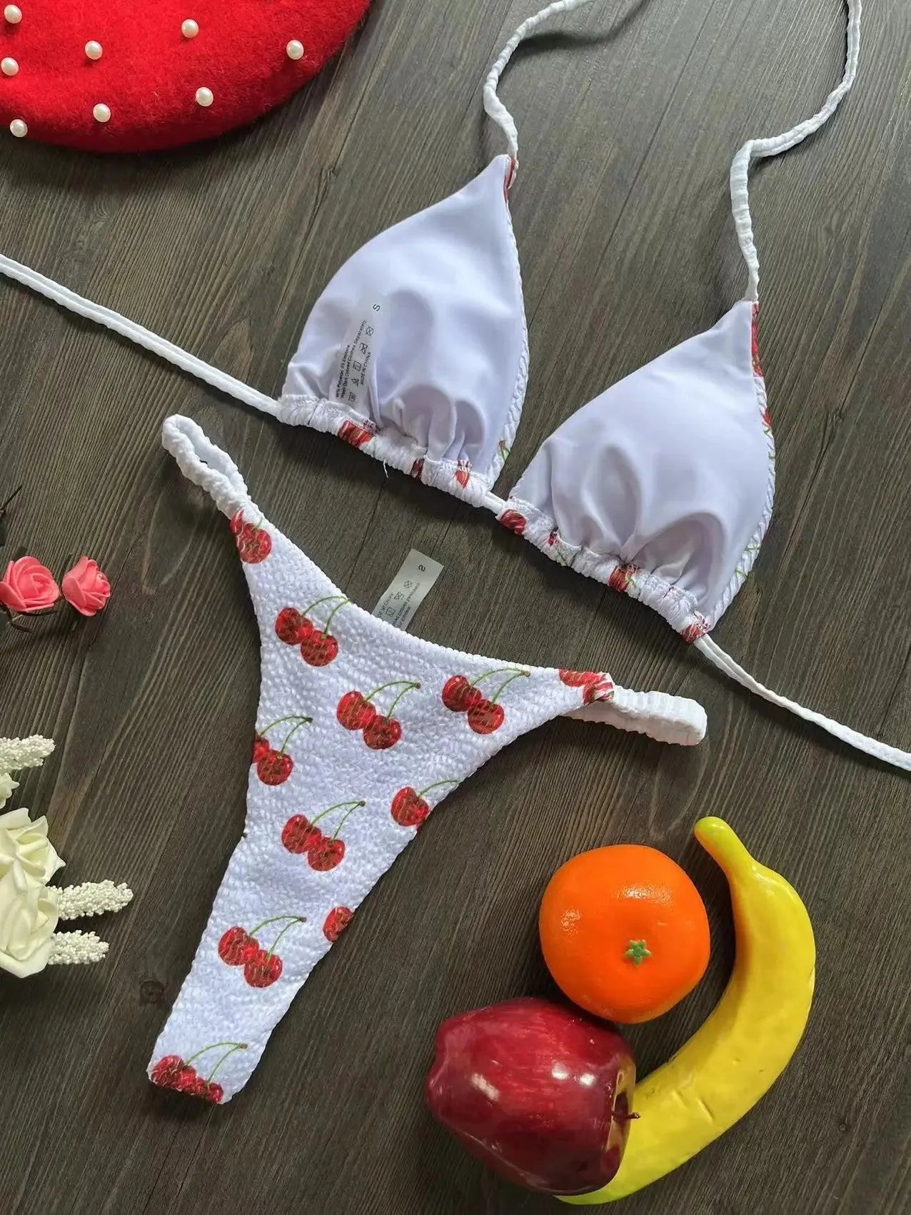 Women's printed bikini swimsuit set with quick-dry fabric on a mannequin, showing briefs style.