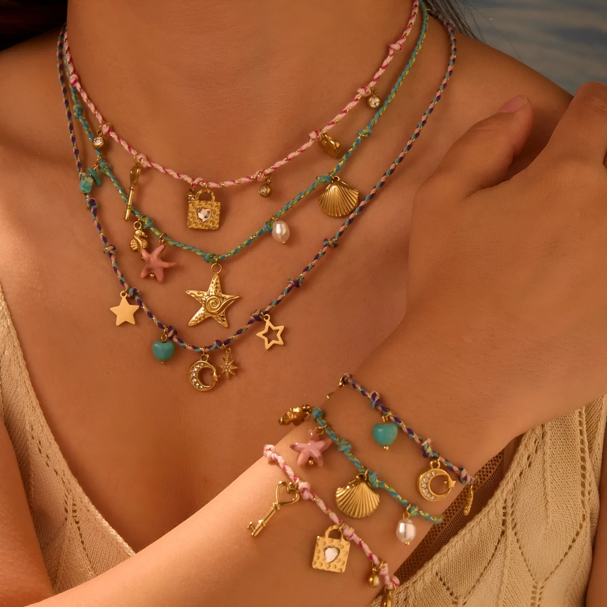 Handmade braided rope titanium steel necklace or bracelet with 18K gold electroplating in purple, pink, or blue styles.