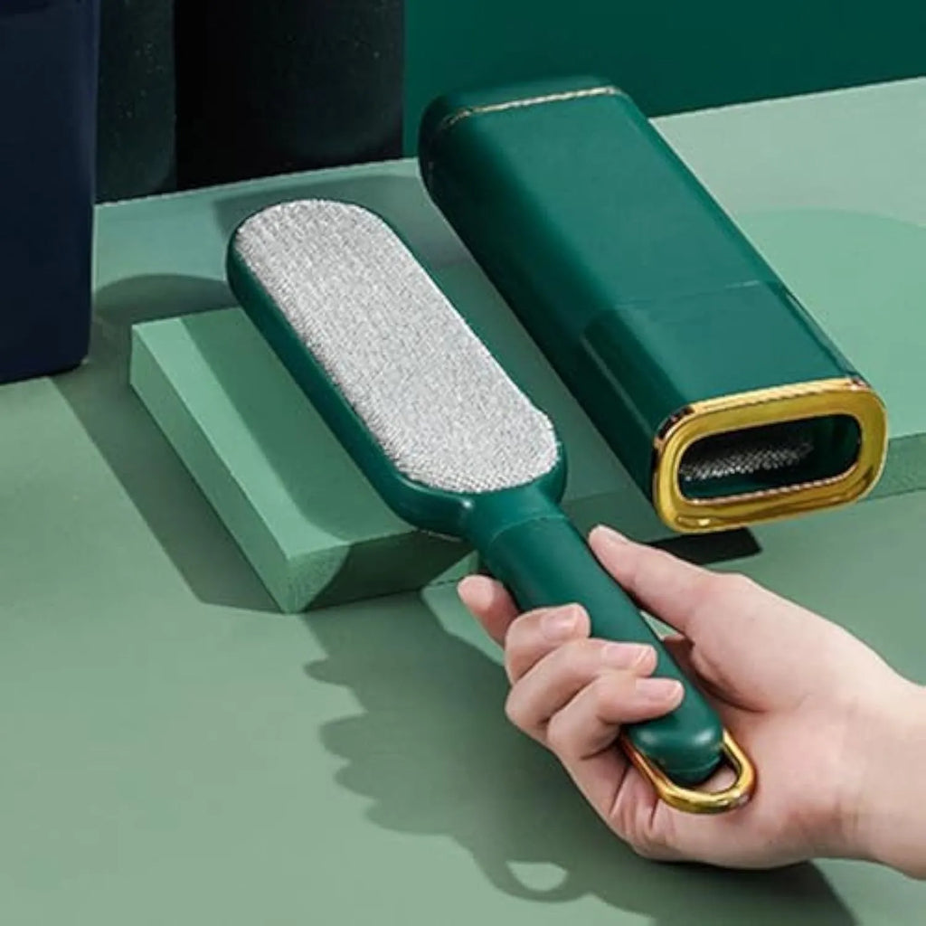 Reusable pet hair remover brush with double-sided head for clothes and furniture.