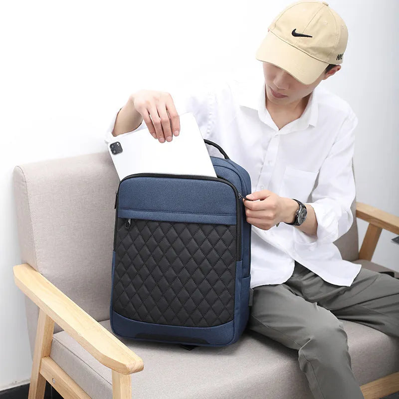 Men's leisure travel backpack in solid black Oxford cloth with curved shoulder straps and diamond mesh detailing