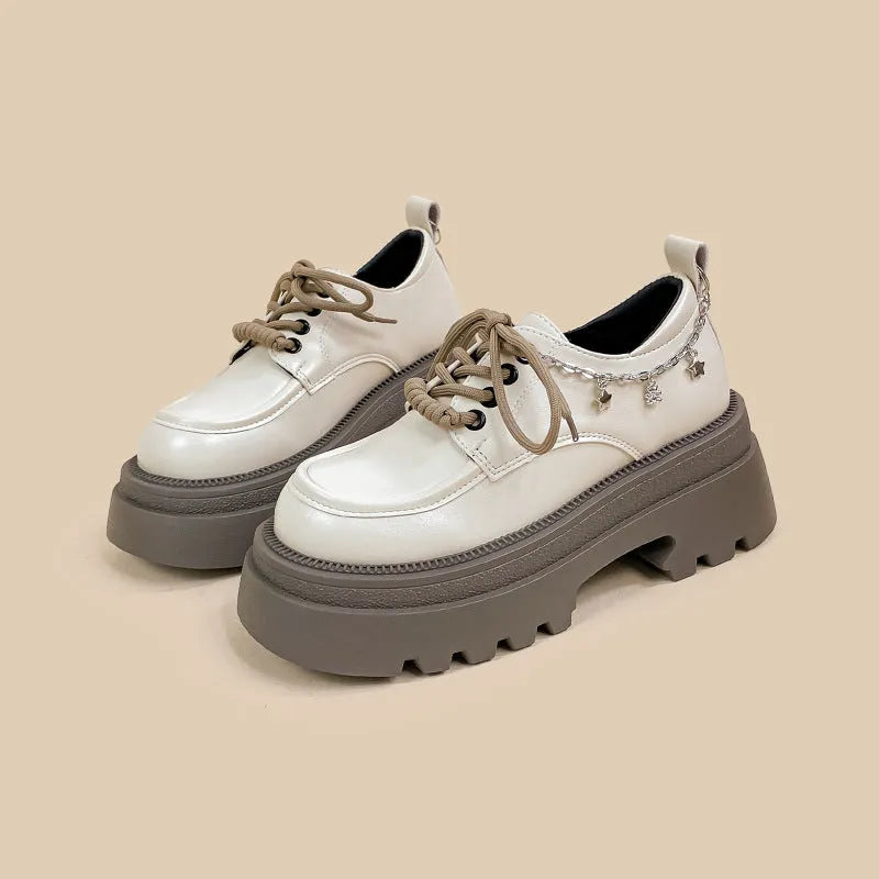 White women's platform Mary Jane shoes with chunky heel and front lace-up fastening.