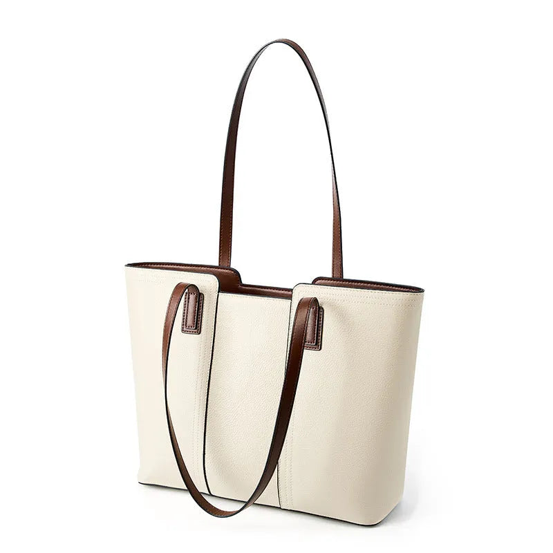 Women's black genuine leather crossbody commuter bag with horizontal square design showing internal organisation compartments