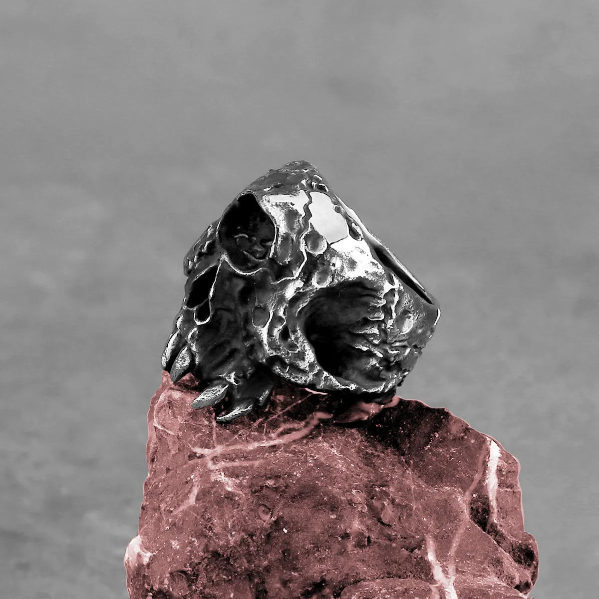 Alloy ring with one-eyed skull design showing electroplated metallic finish