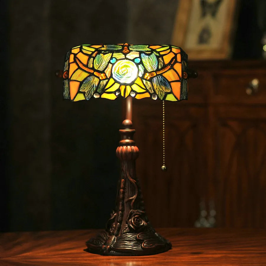 Tiffany stained glass table lamp with coloured glass shade on resin base for desk lighting