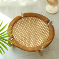 Brown woven rattan pet hammock bed for cats and dogs on a cool mat.