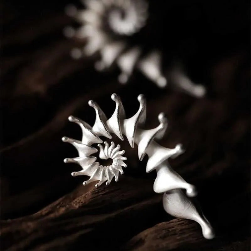 Three-dimensional conch stud earrings with matte finish and irregular design